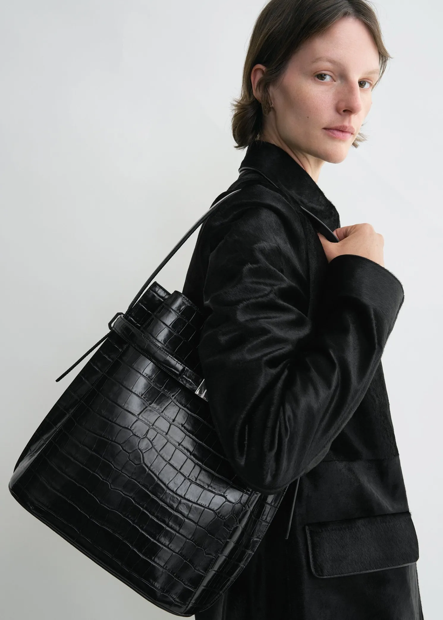 Belted croco-embossed bucket bag black