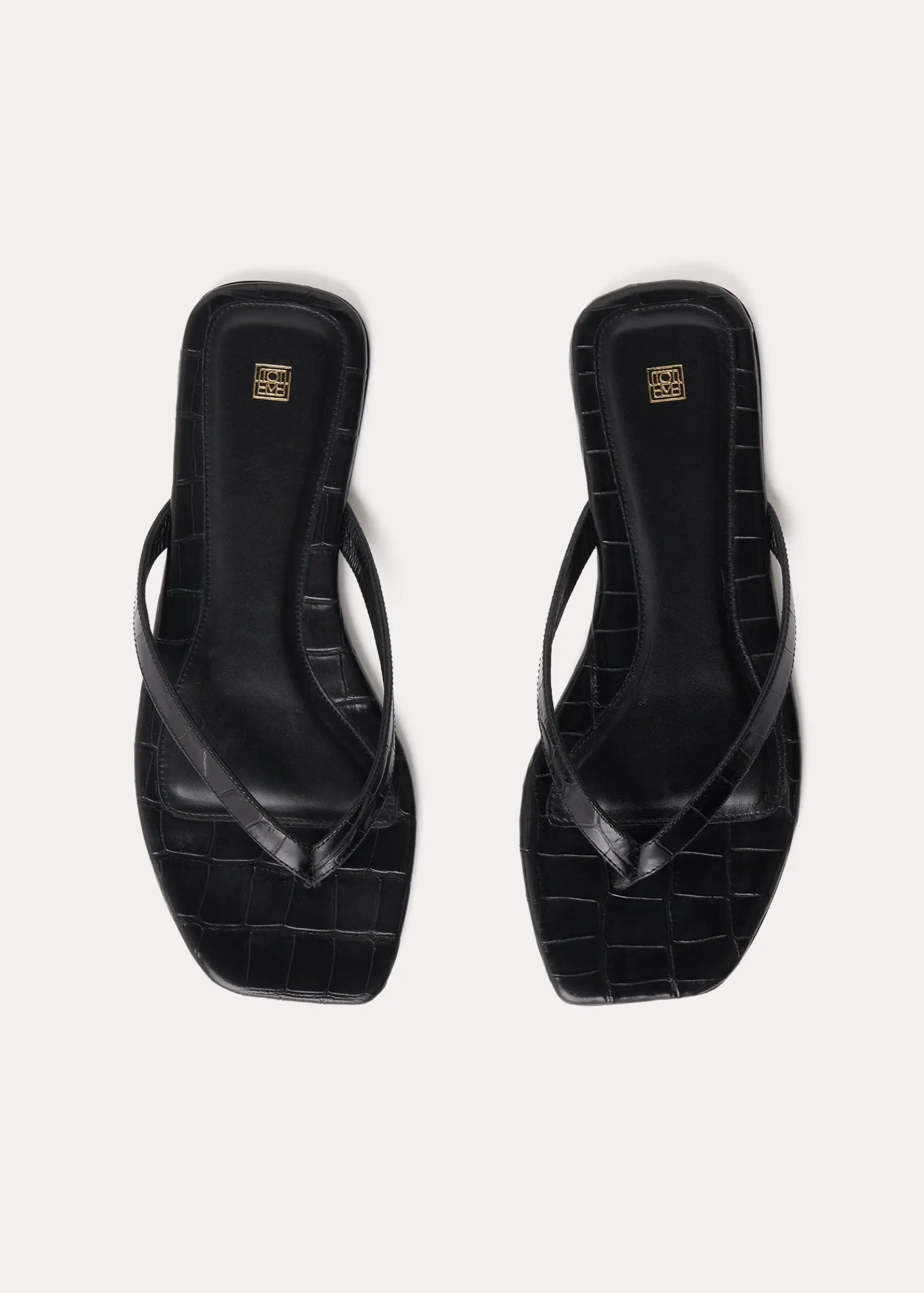 Croco-embossed flip flops black