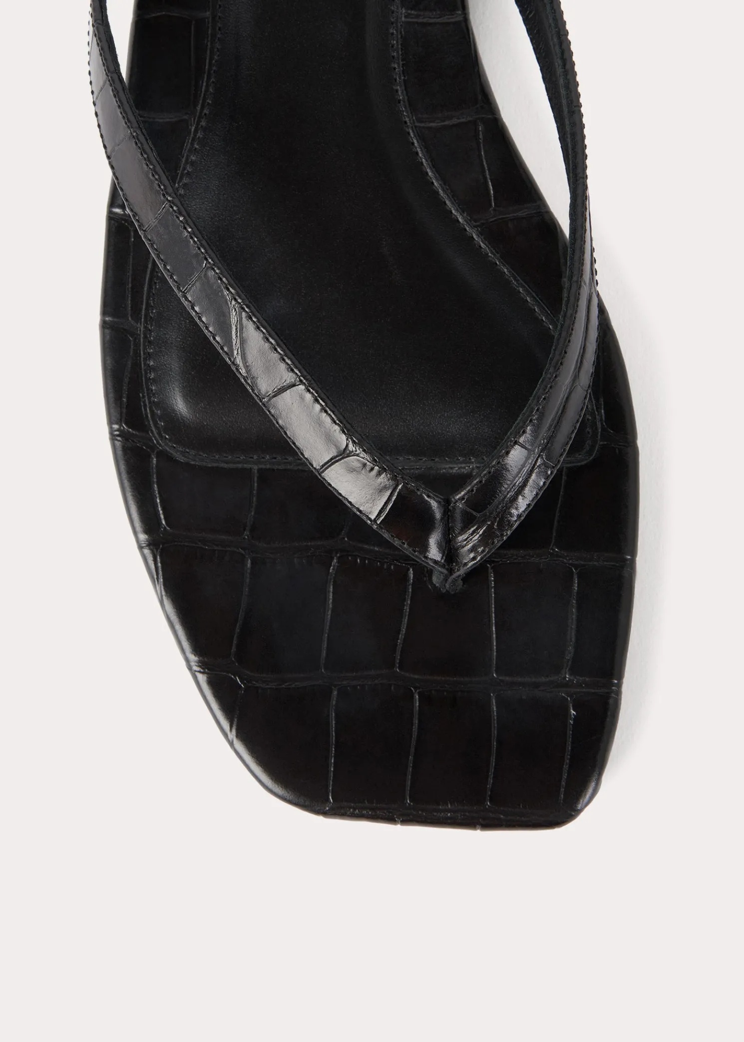 Croco-embossed flip flops black