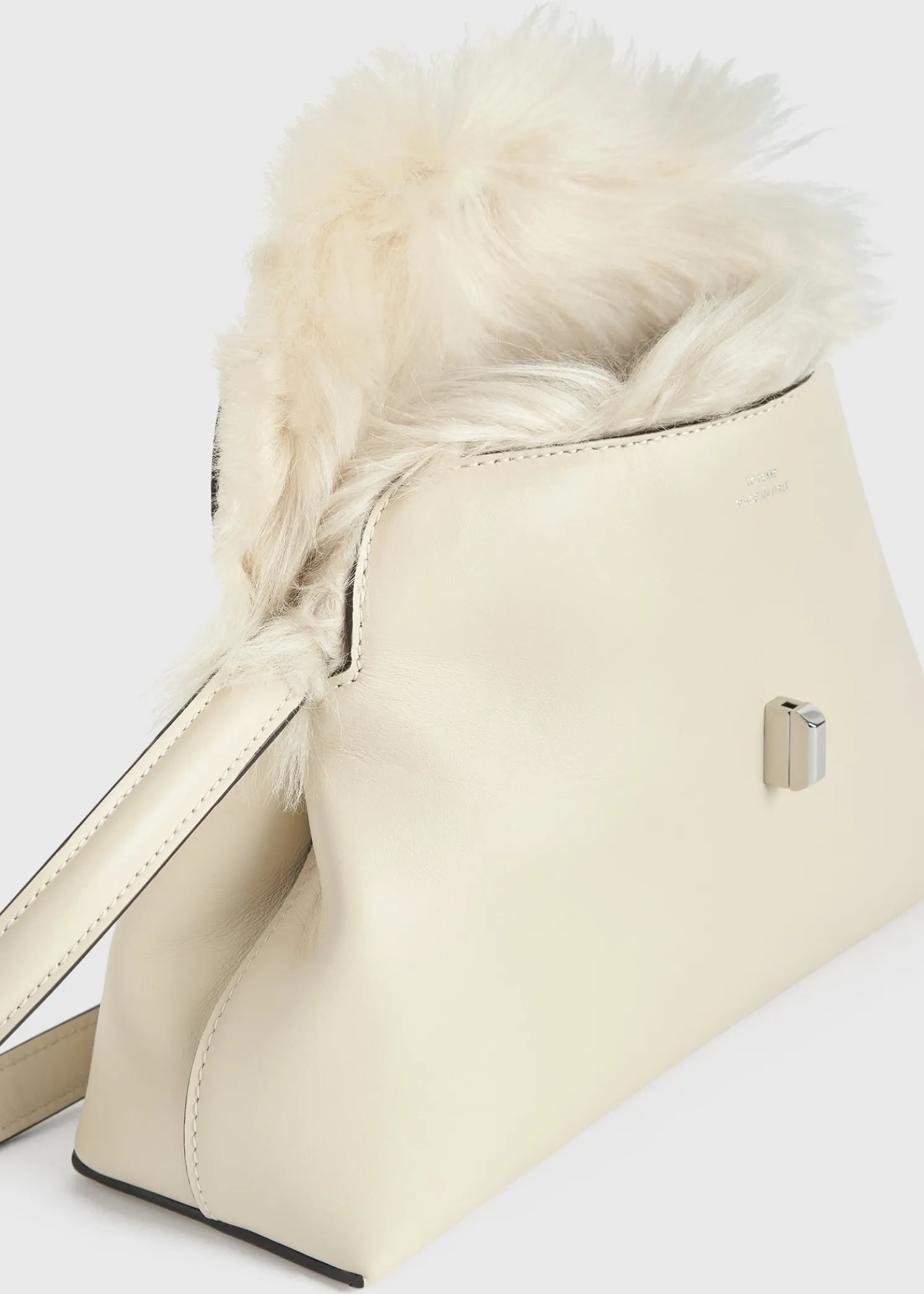 Shearling T-Lock clutch ecru
