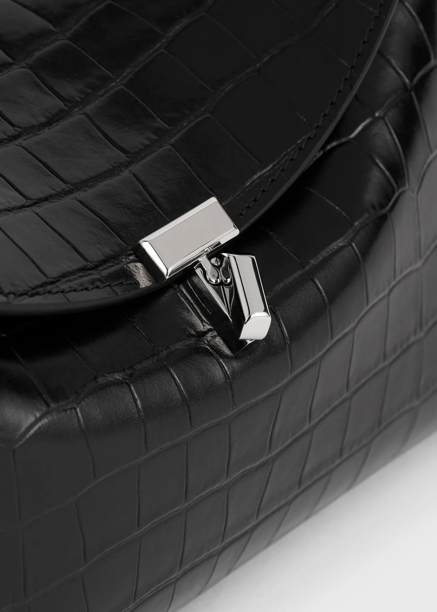 T-Lock croco-embossed clutch black