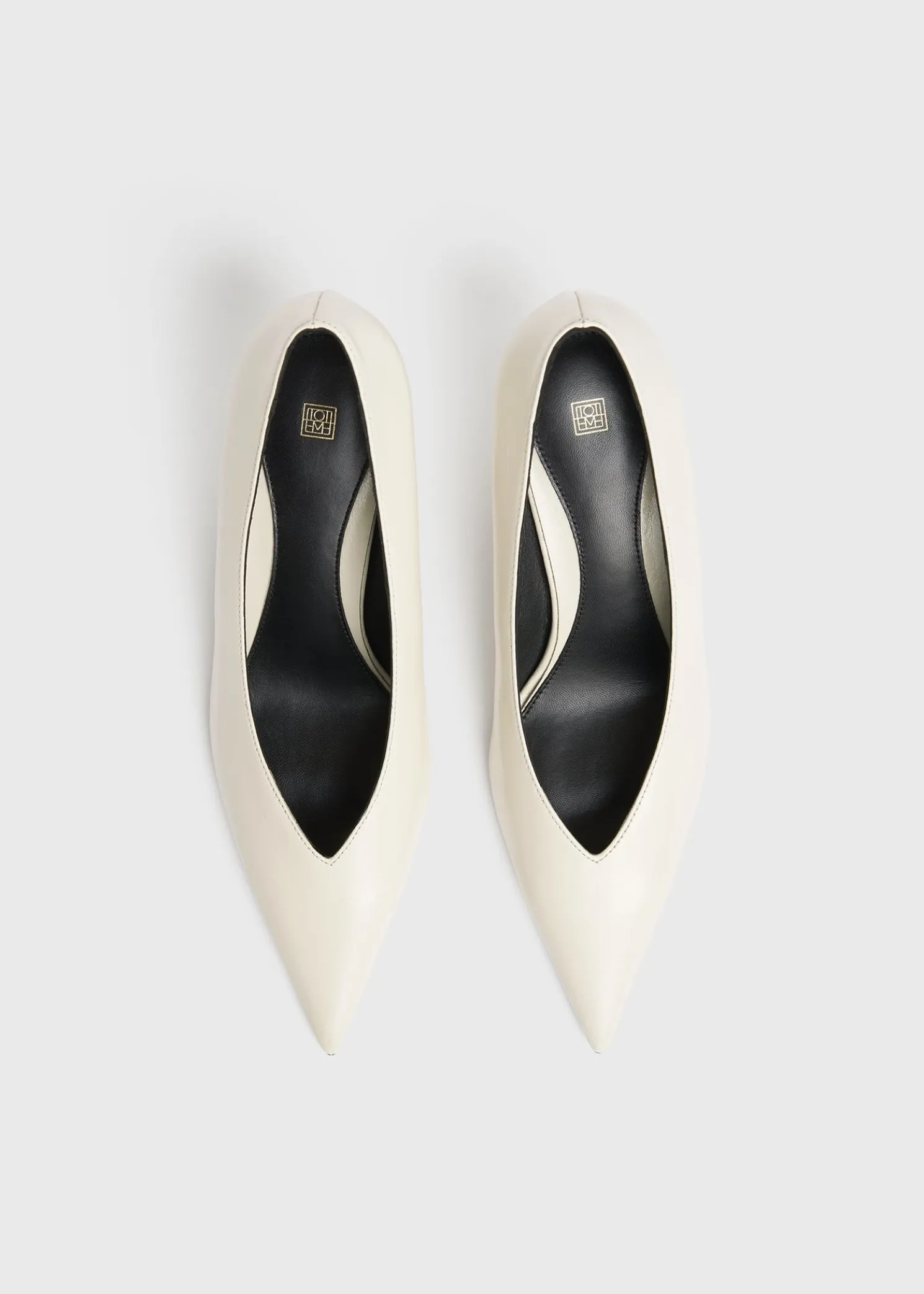 Wedge-heel Naplack pumps bleached sand